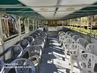 Sweet Tea Yacht Photos Pics Interior of 2016 Rover Marine Carolina Rover 40 with rows of plastic seating.