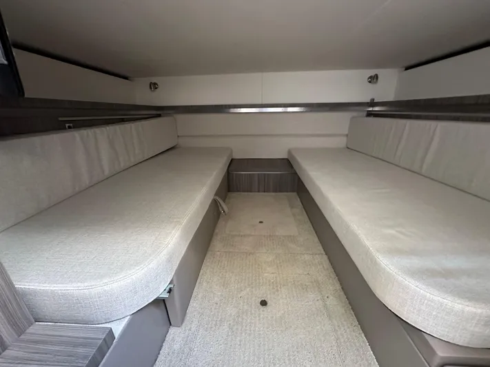 Yacht Photos Pics 2020 Sea Ray Sundancer 320 cabin interior with twin cushioned benches.