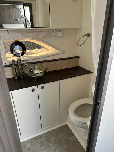  Yacht Photos Pics Modern bathroom in 2020 Sea Ray Sundancer 320 yacht with sleek fixtures and glass sink.
