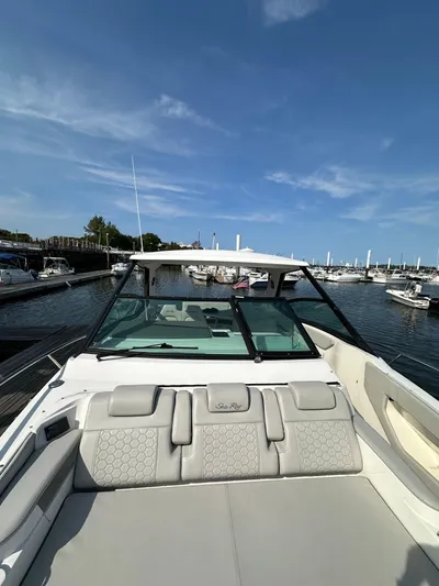  Yacht Photos Pics 2020 Sea Ray Sundancer 320 docked at marina under clear blue sky.