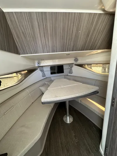  Yacht Photos Pics 2020 Sea Ray Sundancer 320 cabin interior with modern seating and table.