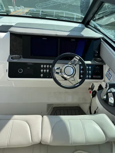  Yacht Photos Pics Cockpit of 2020 Sea Ray Sundancer 320 with modern controls and steering wheel.