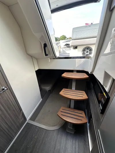  Yacht Photos Pics Interior view of 2020 Sea Ray Sundancer 320 with wooden steps and modern design.