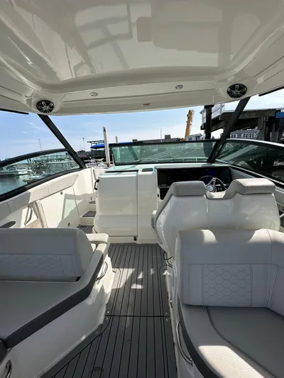  Yacht Photos Pics 2020 Sea Ray Sundancer 320 interior with modern seating and sleek design.