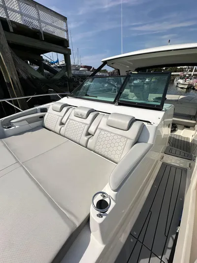  Yacht Photos Pics 2020 Sea Ray Sundancer 320 with luxurious seating and sleek design at a marina.