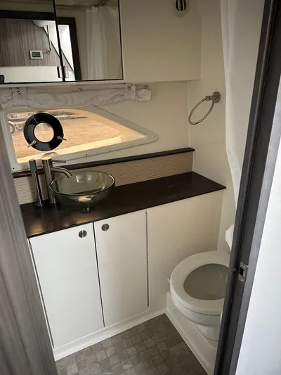  Yacht Photos Pics 2020 Sea Ray Sundancer 320 bathroom with modern sink and toilet.