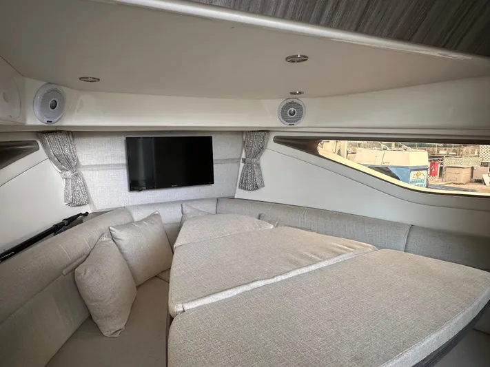  Yacht Photos Pics 2020 Sea Ray Sundancer 320 interior with cozy seating, TV, and modern design.