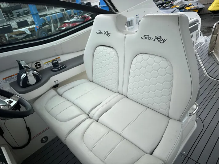  Yacht Photos Pics 2020 Sea Ray Sundancer 320 cockpit with luxurious white leather seating.
