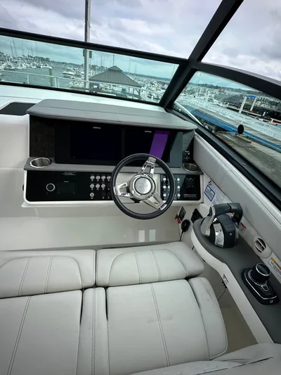  Yacht Photos Pics 2020 Sea Ray Sundancer 320 helm with modern controls and sleek design.