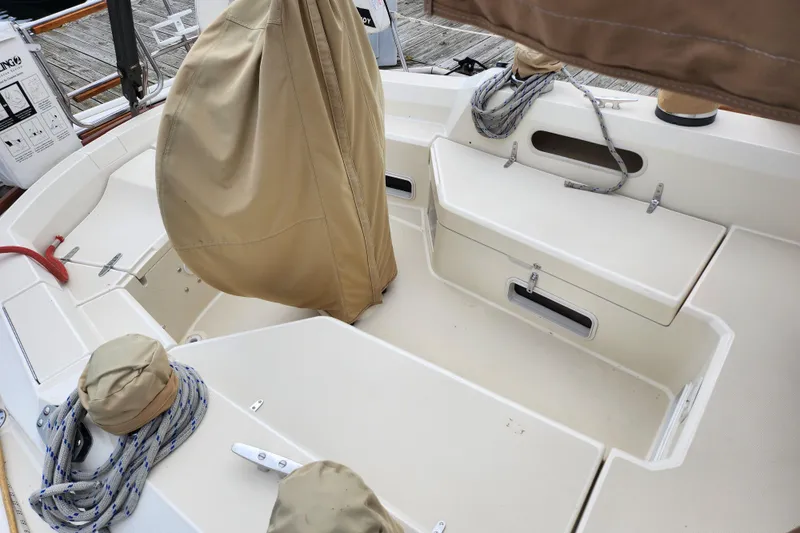 Isola Bella Yacht Photos Pics 1988 Sabre 42 sailboat cockpit with covered equipment and neatly coiled ropes.