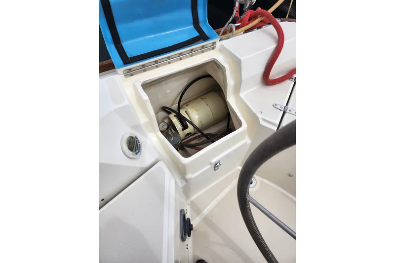 Isola Bella Yacht Photos Pics Open compartment on 1988 Sabre 42 sailboat deck, showing internal components and wiring.