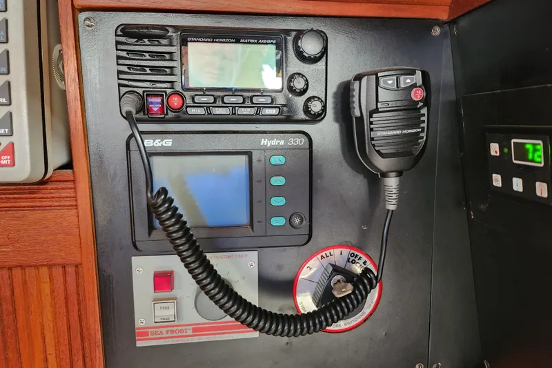 Isola Bella Yacht Photos Pics Control panel of a 1988 Sabre 42 yacht with communication and navigation equipment.