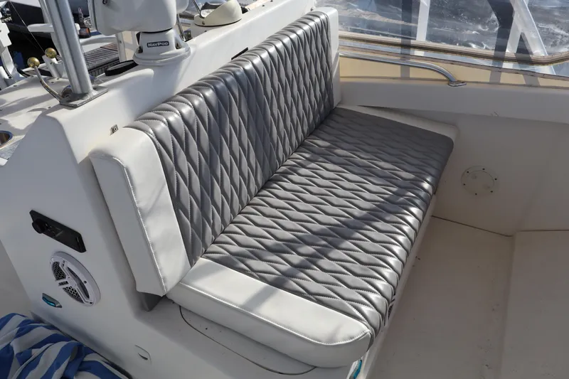  Yacht Photos Pics Luhrs 34 Convertible 2002 boat interior with quilted silver seating.