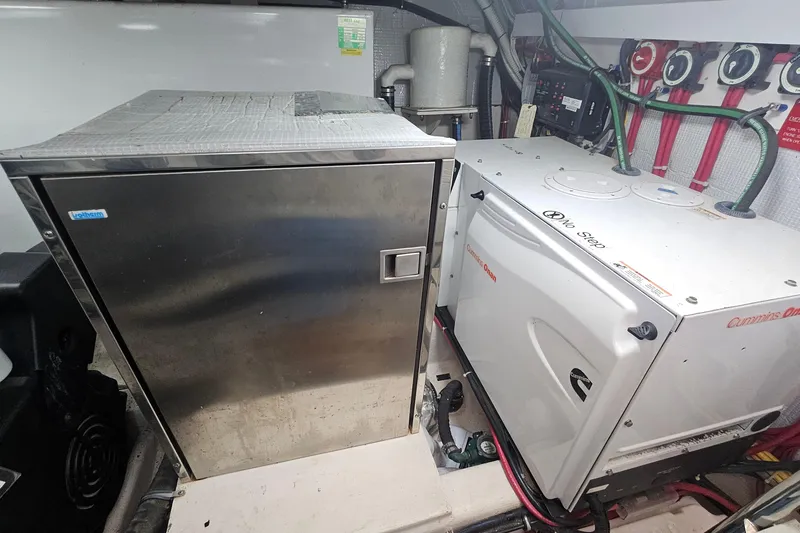  Yacht Photos Pics Engine room of 2009 Sabre 42 Express with Cummins Onan generator and equipment.