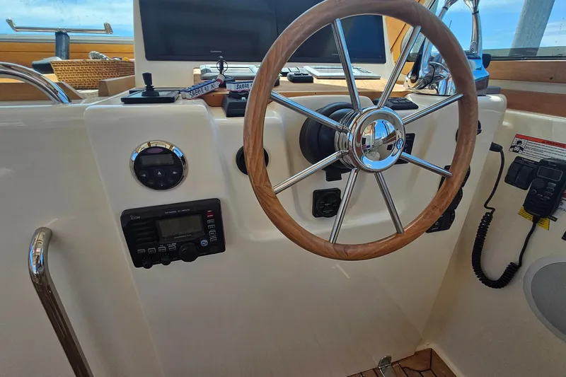  Yacht Photos Pics Steering wheel and controls of 2009 Sabre 42 Express yacht cockpit.