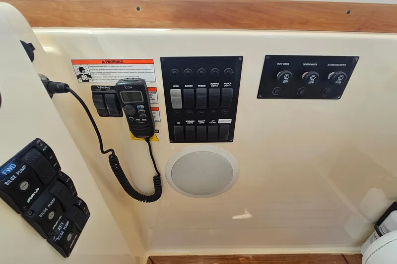  Yacht Photos Pics Control panel of a 2009 Sabre 42 Express boat with switches and communication devices.