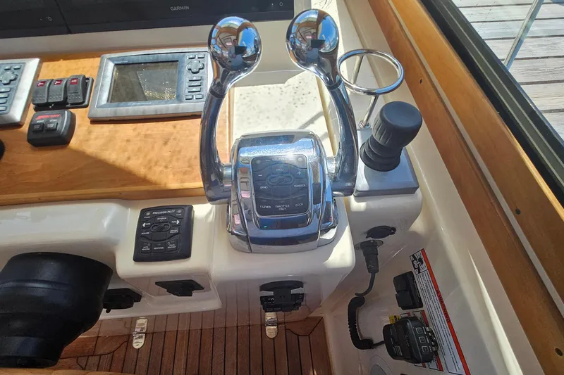  Yacht Photos Pics Control panel of a 2009 Sabre 42 Express boat with throttle and navigation controls.