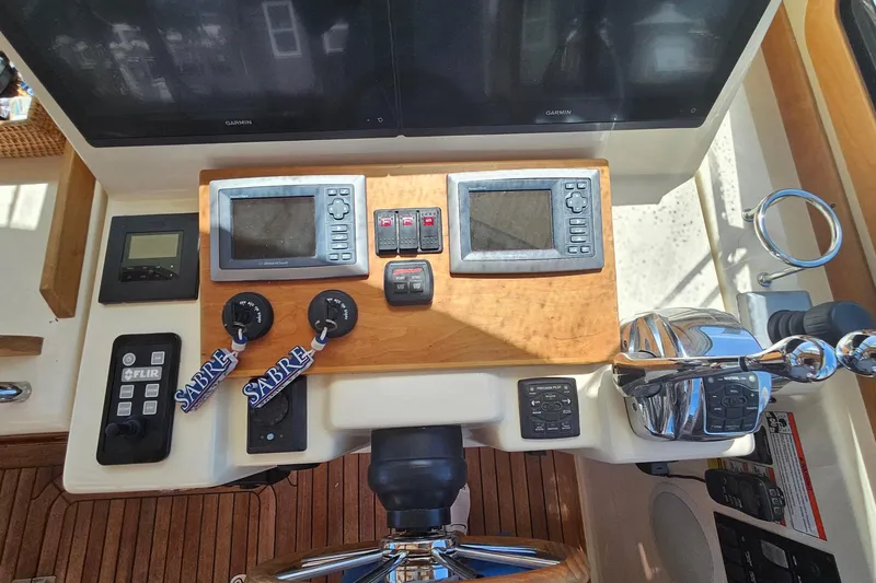  Yacht Photos Pics Helm of 2009 Sabre 42 Express with navigation controls and dual screens.