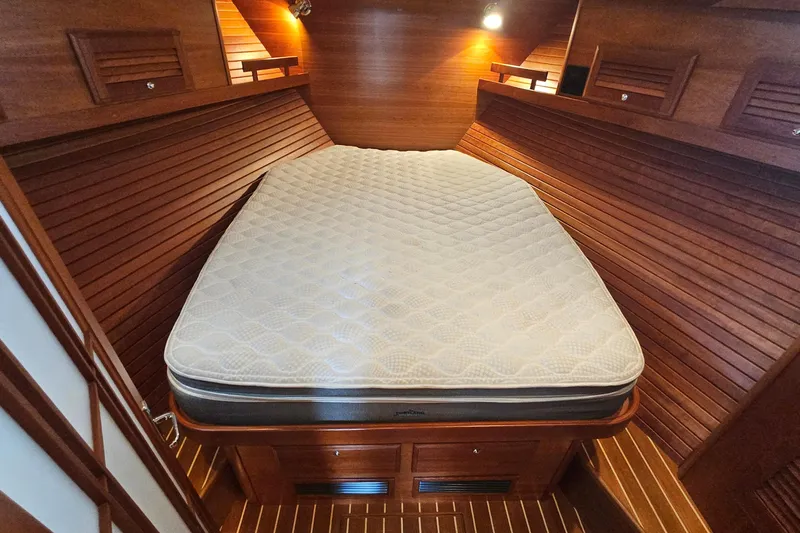  Yacht Photos Pics Luxurious wooden cabin interior of 2009 Sabre 42 Express yacht with cozy bed.