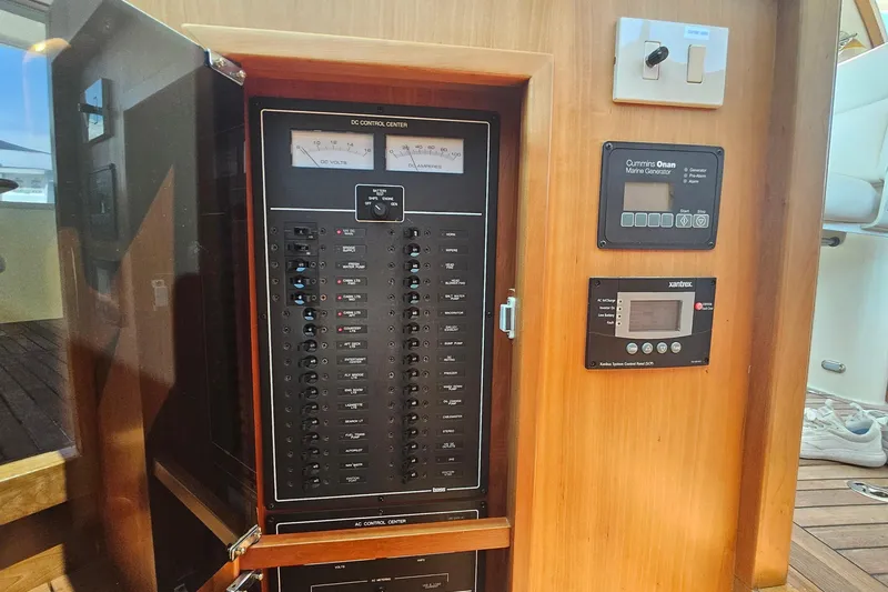  Yacht Photos Pics Electrical control panel on a 2009 Sabre 42 Express yacht, featuring gauges and switches.