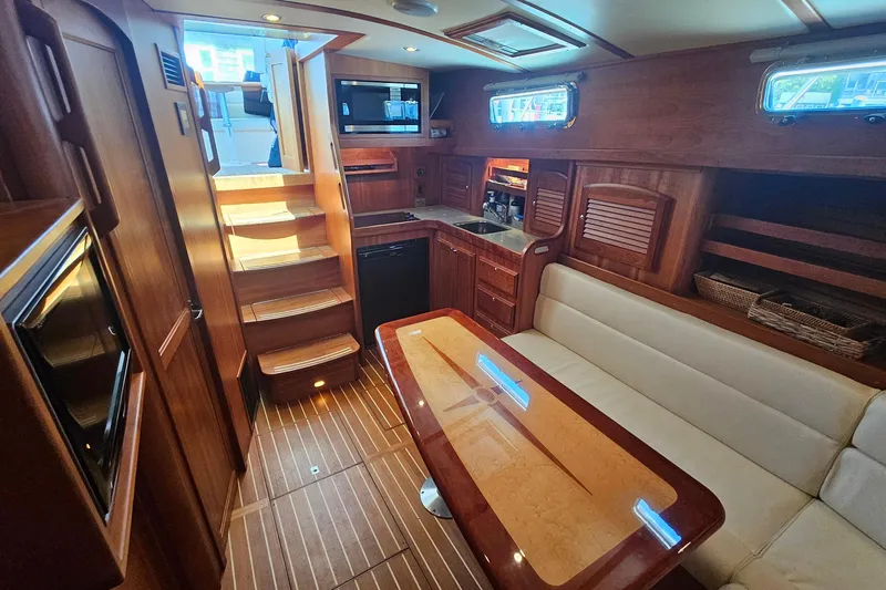  Yacht Photos Pics Luxurious interior of 2009 Sabre 42 Express yacht with wood finishes and modern amenities.