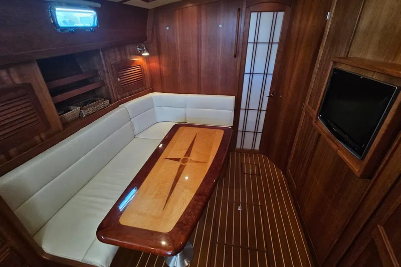 Yacht Photos Pics Luxurious interior of 2009 Sabre 42 Express yacht with elegant wood finish.