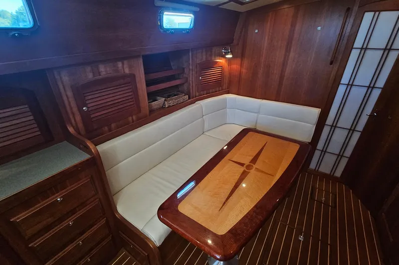  Yacht Photos Pics Luxurious 2009 Sabre 42 Express yacht interior with elegant wood finish and cozy seating area.