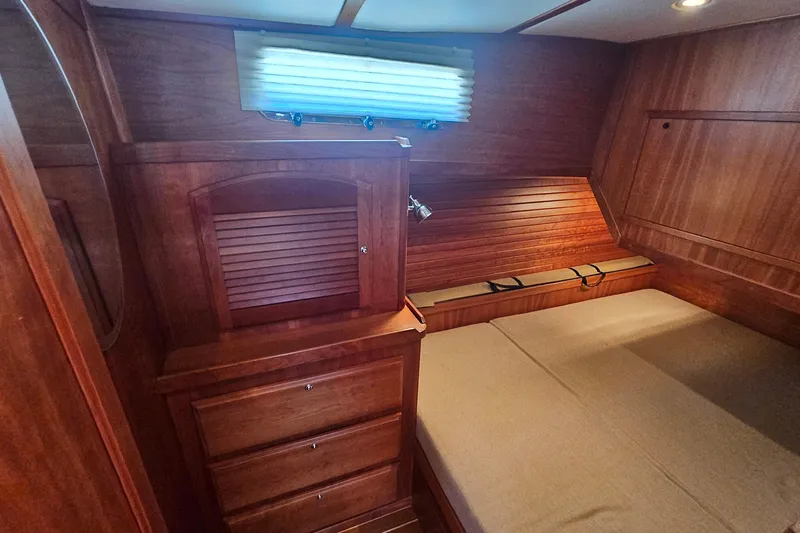  Yacht Photos Pics Cozy cabin interior of 2009 Sabre 42 Express yacht with wooden furnishings.