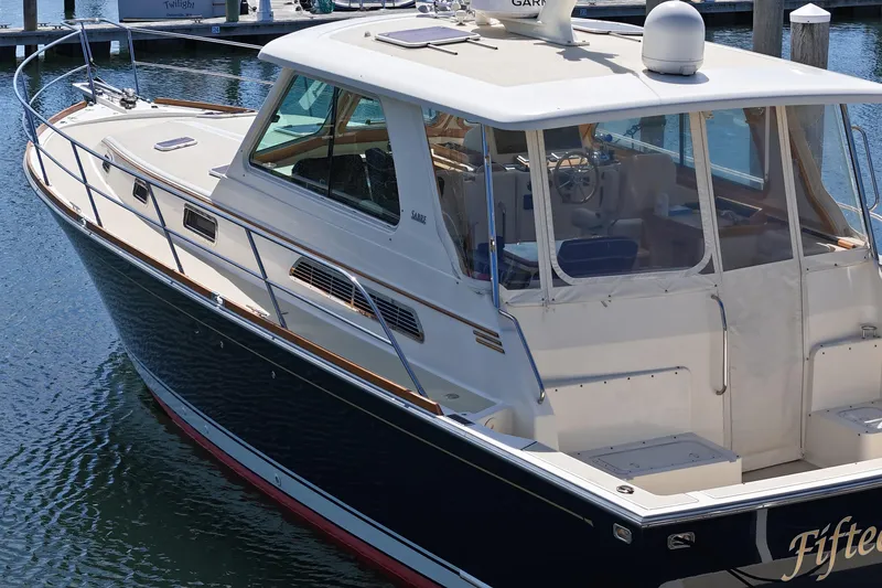  Yacht Photos Pics 2009 Sabre 42 Express yacht docked in marina, showcasing sleek design and spacious deck.