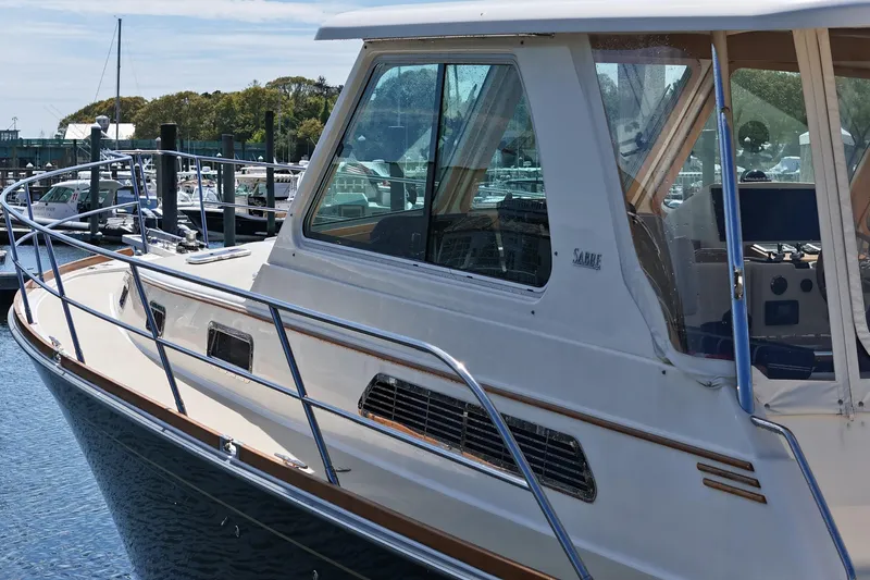  Yacht Photos Pics 2009 Sabre 42 Express yacht docked at marina, showcasing sleek design and spacious cabin.