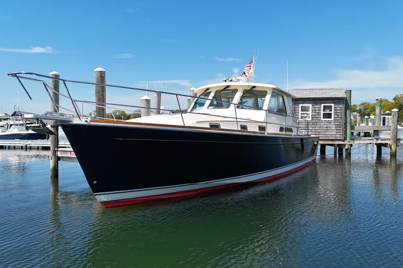  Yacht Photos Pics 2009 Sabre 42 Express yacht docked at marina under clear blue sky.