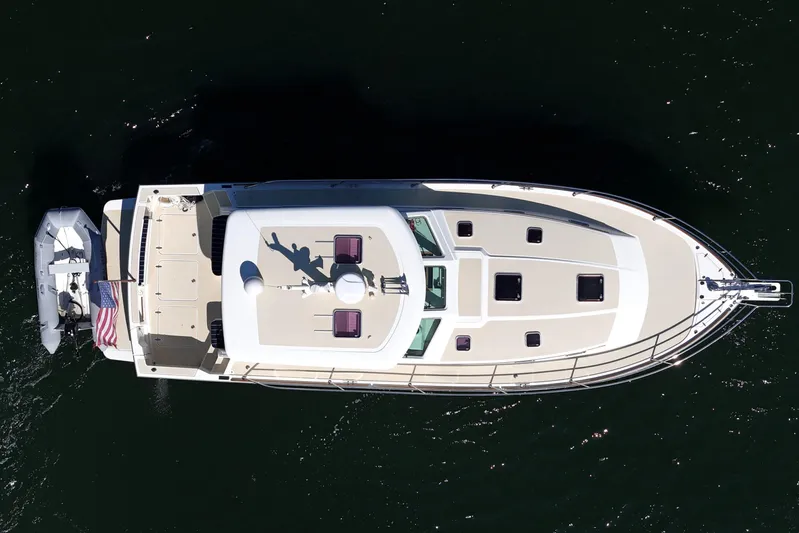  Yacht Photos Pics Overhead view of 2009 Sabre 42 Express yacht on dark water.