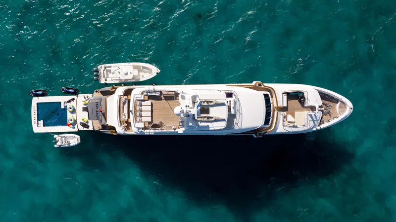 Stay Salty Yacht Photos Pics Aerial view of 2010 Horizon Premier 135 yacht on turquoise water.