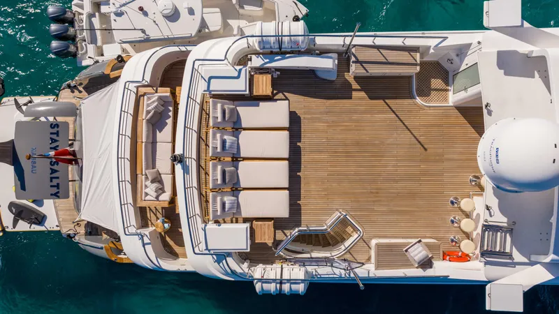 Stay Salty Yacht Photos Pics Aerial view of Horizon Premier 135 yacht deck, 2010 model, with seating and sunbathing area.