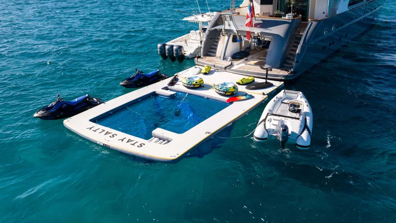 Stay Salty Yacht Photos Pics Luxury yacht with floating pool and jet skis, Horizon Premier 135, 2010 model.