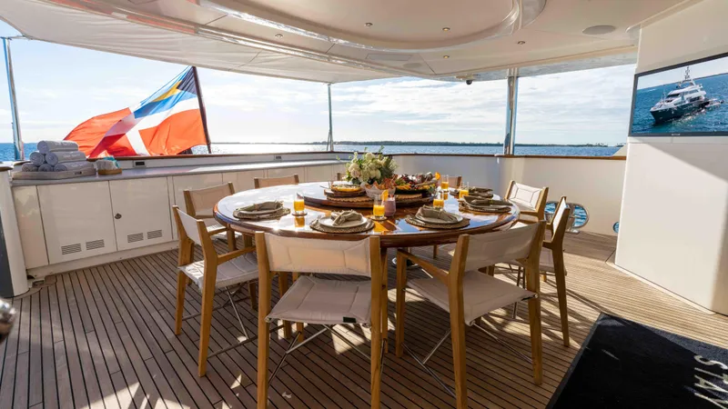 Stay Salty Yacht Photos Pics Luxurious yacht dining area with elegant table setting, Horizon Premier 135, 2010 model.