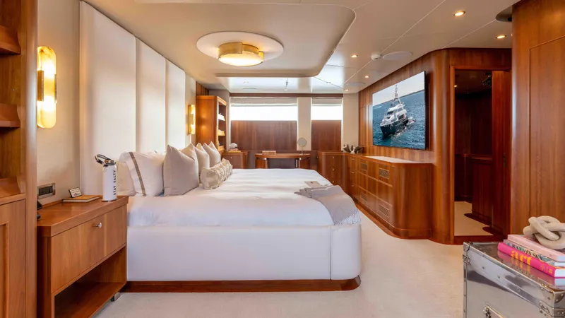 Stay Salty Yacht Photos Pics Luxurious yacht interior with elegant wood paneling and plush bedding, Horizon Premier 135, 2010.