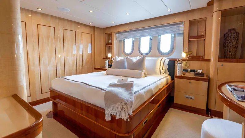 Stay Salty Yacht Photos Pics Luxurious yacht bedroom with elegant wood finishes, Horizon Premier 135, 2010 model.