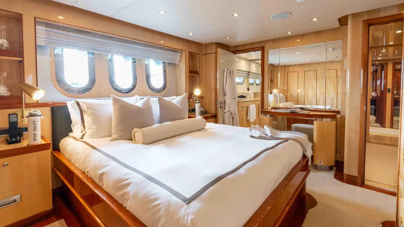 Stay Salty Yacht Photos Pics Luxurious bedroom interior on 2010 Horizon Premier 135 yacht with elegant decor.