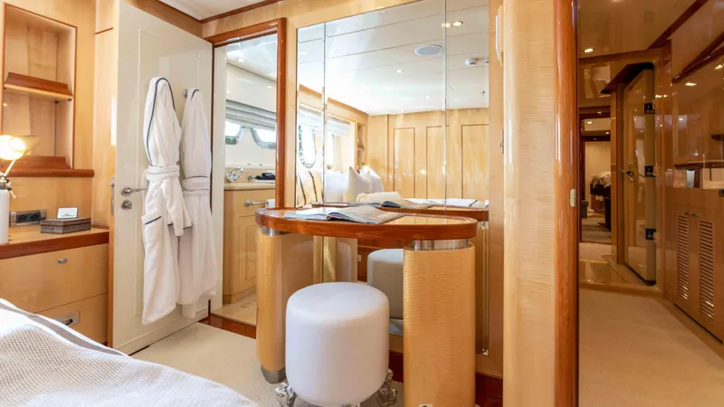 Stay Salty Yacht Photos Pics Luxurious yacht interior with vanity, robes, and elegant wood finishes, Horizon Premier 135, 2010.