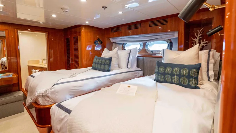 Stay Salty Yacht Photos Pics Luxurious cabin interior of 2010 Horizon Premier 135 yacht with twin beds.