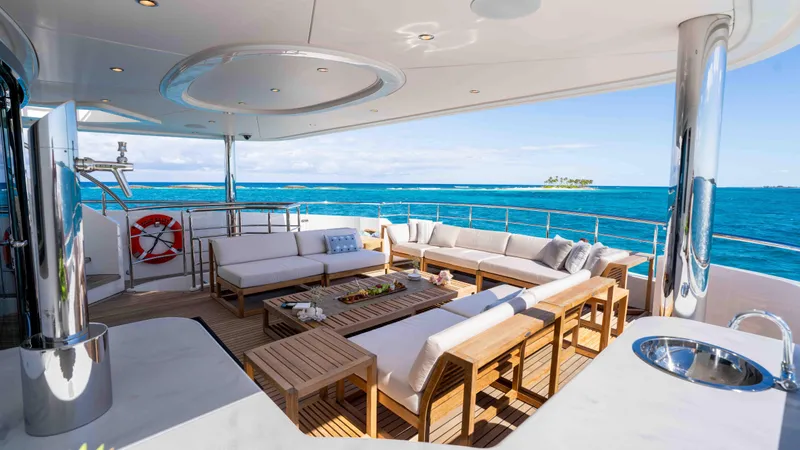 Stay Salty Yacht Photos Pics Luxurious Horizon Premier 135 yacht deck with elegant seating, ocean view, and modern amenities.
