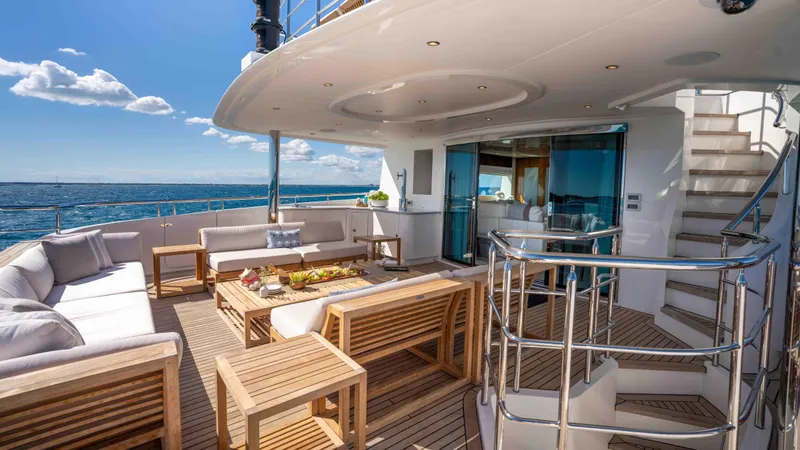 Stay Salty Yacht Photos Pics Luxurious Horizon Premier 135 yacht deck with elegant seating and ocean view, 2010 model.