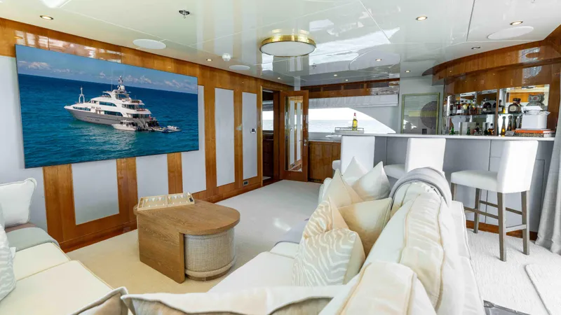 Stay Salty Yacht Photos Pics Luxurious yacht interior with elegant seating, bar area, and ocean view artwork. Horizon Premier 135, 2010.