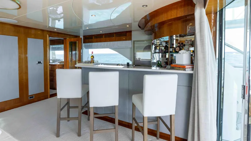 Stay Salty Yacht Photos Pics Luxurious yacht interior with bar and white chairs, Horizon Premier 135, 2010 model.