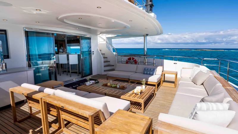 Stay Salty Yacht Photos Pics Luxurious Horizon Premier 135 yacht deck with elegant seating, ocean view, and modern design.