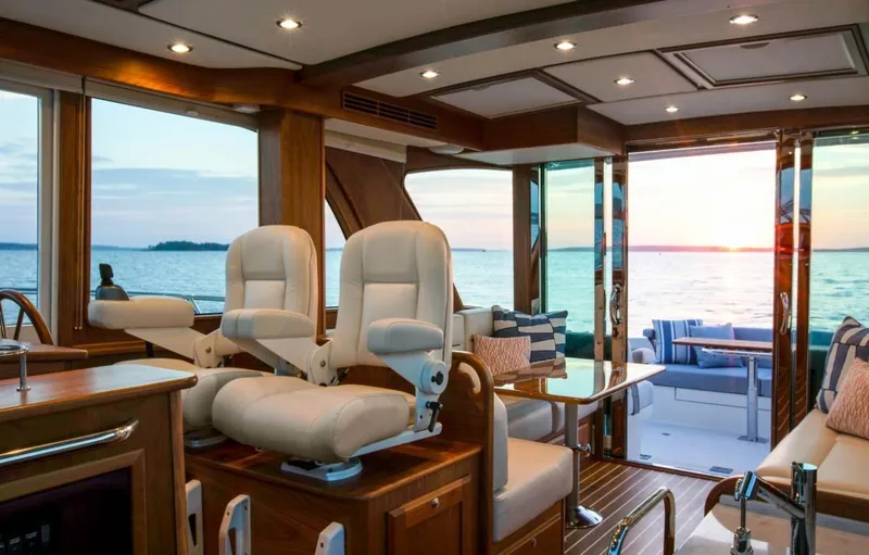 Call For Availability Yacht Photos Pics Luxurious interior of 2025 Sabre 43 Salon Express yacht at sunset.