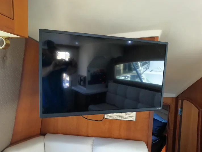  Yacht Photos Pics Flat-screen TV in the cabin of a 2002 Luhrs 34 Convertible boat.