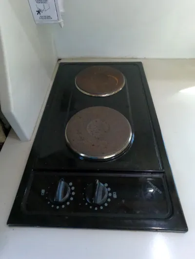  Yacht Photos Pics Two-burner electric stove in a 2002 Luhrs 34 Convertible boat kitchen.