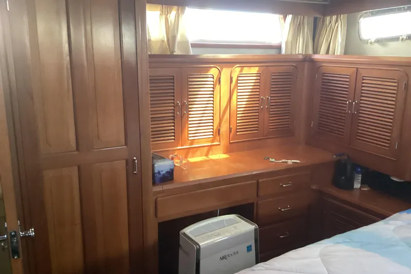 No Reservations Yacht Photos Pics 1984 Spindrift 52 Motor Yacht interior with wooden cabinetry and natural light.